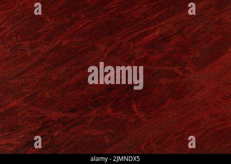 Red granite, natural polished stone slab texture for perfect interior. Stock Photo