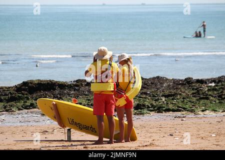 Broadstairs, Kent, UK. 7th Aug, 2022. RNLI Lifeguards on beach patrol on a hot August weekend at Broadstairs, Kent, UK Credit: Grant Burton/Alamy Live News Stock Photo