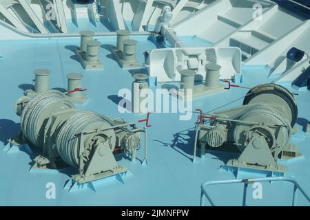 The anchor, anchor windlass and winches on  the main deck of a cruise ship Stock Photo