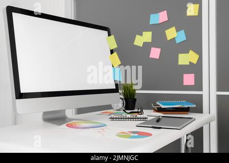 Personal computer office workspace with sticky notes Stock Photo