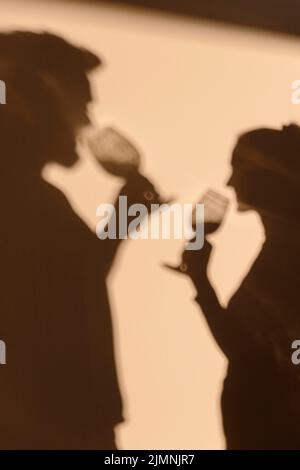 Silhouettes man woman having date home Stock Photo