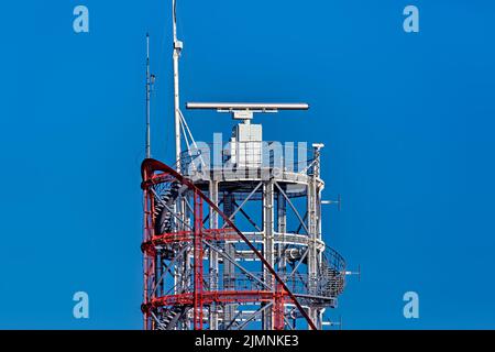 Marine radar with rotating antenna. Coastal surveillance system. Stock Photo