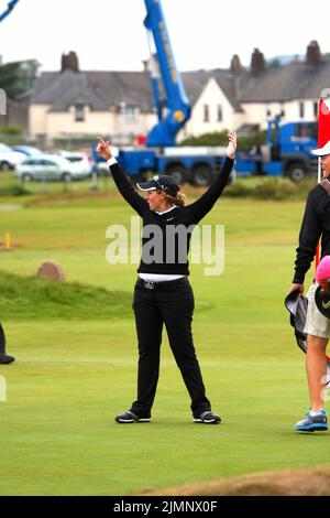 Ashleigh Buhai of South Africa celebrates scoring a hole-in-one on the 16th green during final practice round of 2011 Ricoh Women's British Open held Stock Photo