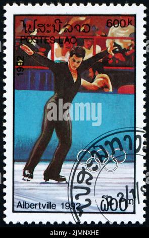 LAOS - CIRCA 1992: a stamp printed in Laos shows figure skater, 1992 Winter Olympics, Albertville, Canada, circa 1992 Stock Photo
