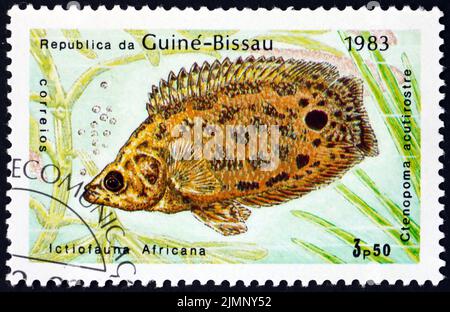 GUINEA-BISSAU - CIRCA 1983: a stamp printed in Guinea-Bissau shows leopard bush fish, ctenopoma acutirostre, is a freshwater fish endemic to the Congo Stock Photo