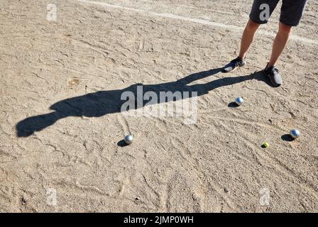 07 August 2022, Schleswig-Holstein, Lübeck: Boule balls lie in the sand. The Holstentor tournament is considered the largest German boules tournament. Photo: Georg Wendt/dpa Stock Photo