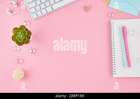 Part of blank notepad page in bullet journal on bright pink office desktop Stock Photo