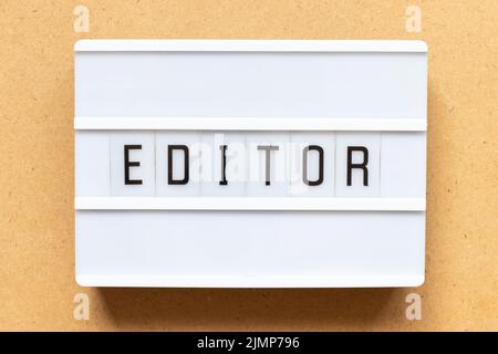 Lightbox with word editor on wood background Stock Photo