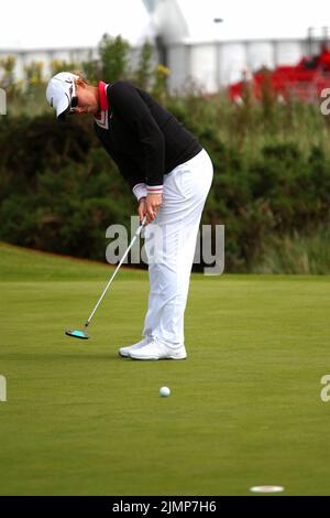 Ashleigh Buhai of South Africa practices putts on the 9th hole during final practice round of 2010 Ricoh Women's British Open held at Royal Birkdale o Stock Photo