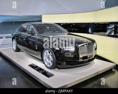 26.07.2013, Germany, Munich: Full-size luxury black car Rolls-Royce Ghost on exhibition at BMW museum in Munich Germany. High quality photo Stock Photo