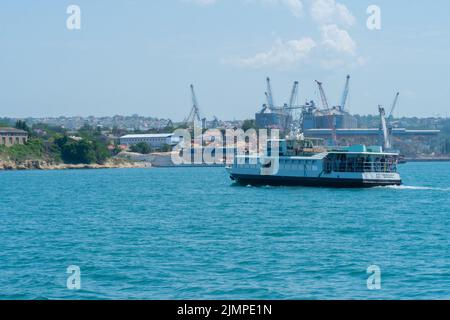 RUSSIA, CRIMEA - JUL 08, 2022: Ship bulbous large yupiter cargo bow view ocean shipping marine, for industry vessel in power from industrial abstract Stock Photo