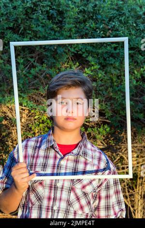 Handsome boy in a white frame Stock Photo