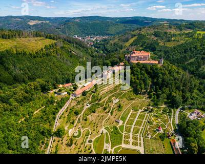 Aerial drone fly near the Pernstejn castle, Czech Republic. Vysocina region near the Nedvedice village. Summer day with sun and blue sky. Green nature Stock Photo