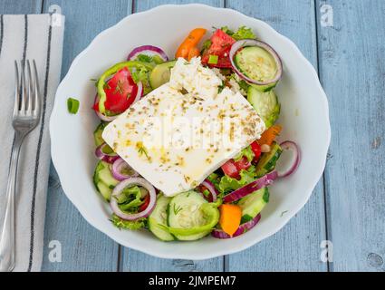 Greek rustic salad with extra virgin olive oil Stock Photo