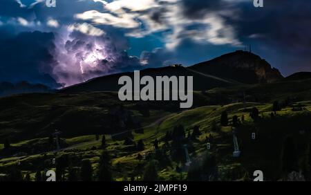 Lightning bolt hits during night thunderstorm in the Dolomites. Italy, Dolomites. Stock Photo