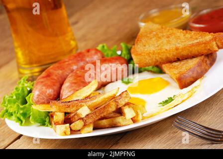 Fried eggs with sausages Stock Photo