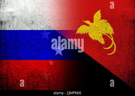 National flag of Russian Federation with The Independent State of Papua New Guinea National flag. Grunge background Stock Photo