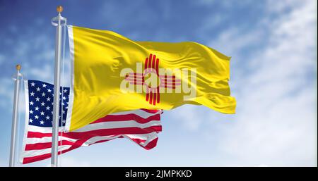 The New Mexico state flag waving along with the national flag of the United States of America Stock Photo