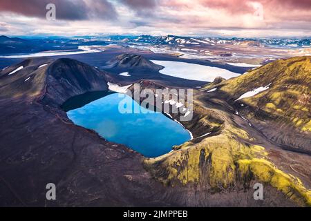 Hnausapollur or Blahylur volcano crater with blue pond on Icelandic highlands in the sunset on summer at Iceland Stock Photo