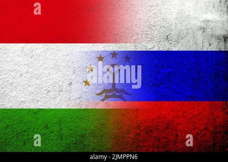 National flag of Russian Federation with The Republic of Tajikistan National flag. Grunge background Stock Photo