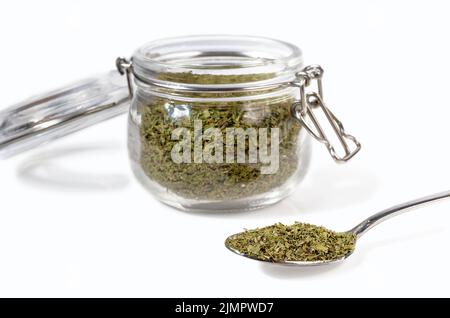 Dry mint in a glass jar on a white background. Stock Photo