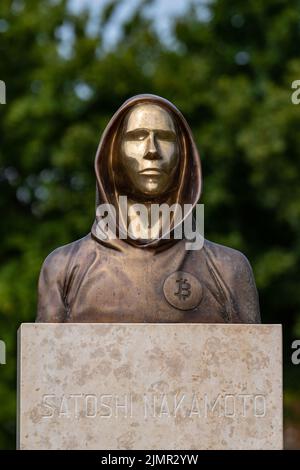 Budapest, Hungary -August 7, .2022:  Portrait of the statue of Satoshi Nakamoto mysterious founder of Bitcoin and Blockchain technology in; created by Stock Photo