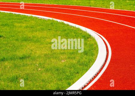 Straight red running empty lines on stadium Stock Photo - Alamy