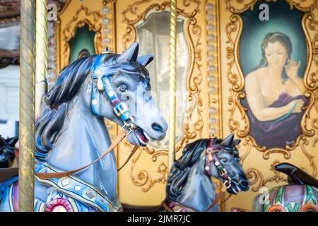 Florence, Italy - Circa March 2022: vintage carousel horse - antique attraction. Stock Photo