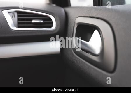 Detail of interior Car door handle. Stock Photo
