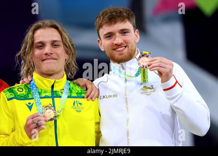 Australia's Cassiel Emmanuel Rousseau (left) celebrates with his gold medal alongside England's Matthew Lee who took bronze in the Men's 10m Platform Diving Final at Sandwell Aquatics Centre on day ten of the 2022 Commonwealth Games in Birmingham. Picture date: Sunday August 7, 2022. Stock Photo