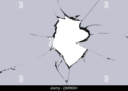 Broken glass hole. Photo of cracks on the window. Texture for design Stock Photo