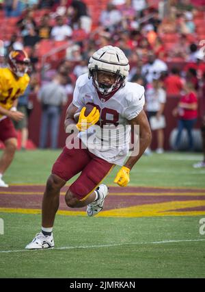 Washington Commanders tight end Armani Rogers 88 gets a block