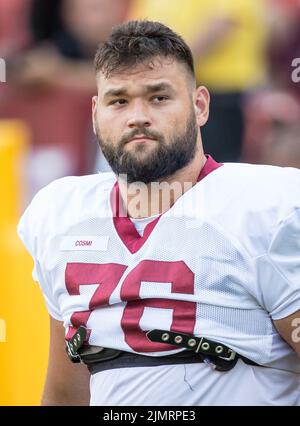 Washington Commanders T Sam Cosmi (76) taking the field during pregame ...