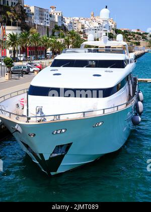 Front view from above of a white yacht moored in the port of Mahon on the island of Menorca, Spain Stock Photo