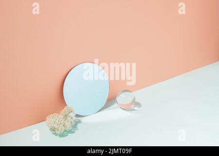 Creative minimalistic podium background various materials, glass mirror, blue coral pastel background Stock Photo