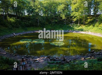 Kaali, Estonia - August 5, 2022: Kaali meteorite crater (Kaali kraater). Meteorite fall created a crater with diameter of 110 m and a depth of 22 m. Stock Photo