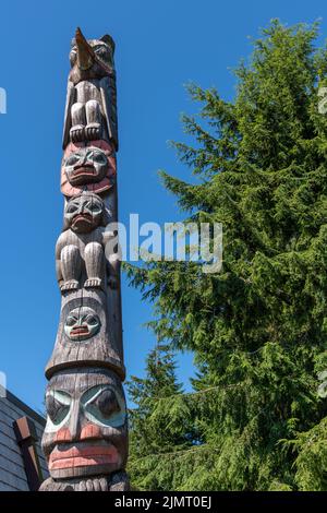 Raven Stealing the Sun Native Alaskan totem pole outside the Tongass Historical Museum in Ketchikan, Alaska. Stock Photo