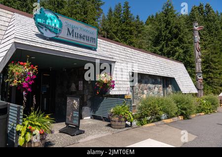The entrance to the Tongass Historical Museum with the the Native Alaskan totem pole called Raven Stealing the Sun in Ketchikan, Alaska. Stock Photo