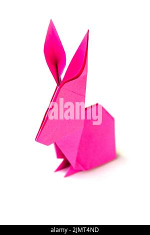 Pink paper rabbit origami isolated on a white background Stock Photo