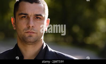 Close up portrait of serious caucasian millennial 30s elegant hispanic businessman boss director investor looking at camera posing male smart human Stock Photo