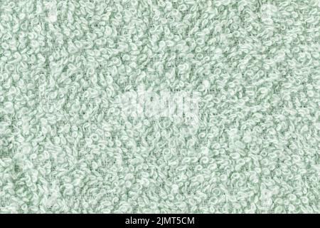 Mint green bath sheet or towels texture background. Bathroom body hygiene or spa concept. Close up, copy space Stock Photo