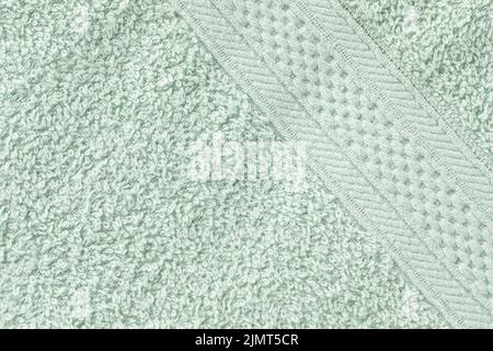 Mint green bath sheet or towels texture pattern background. Bathroom body hygiene or spa concept. Close up, copy space Stock Photo