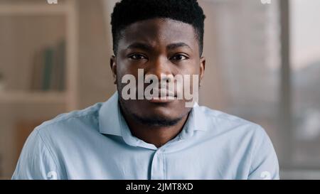 Portrait of concentrated african businessman brunet young guy with confident calm serious eyesight focused male adult person american entrepreneur Stock Photo