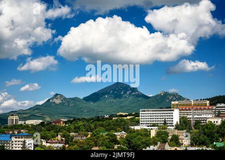 Landscape of Pyatigorsk, view of Beshtau Mount under beautiful clouds, Russia. This mountain is landmark of Stavropol Krai. Scenery of Pyatigorsk and Stock Photo