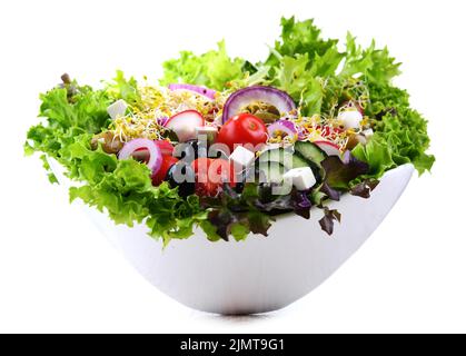 Vegetable salad bowl isolated on white background. Stock Photo