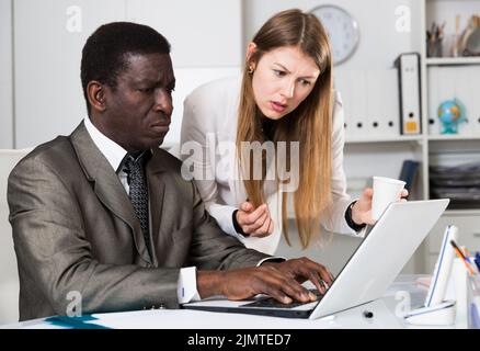 Focused coworkers working together Stock Photo