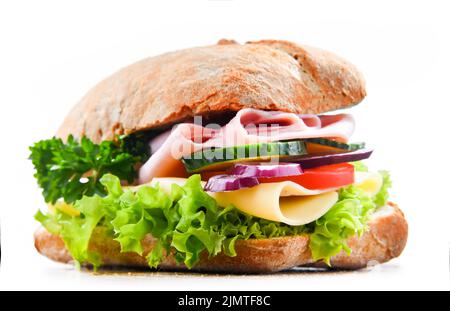 Sandwich with cheese and ham and fresh vegetables isolated on white. Stock Photo