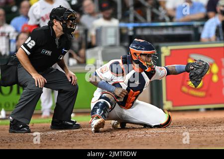 MLB umpire James Hoye (92) and Houston Astros catcher Martin Maldonado (15) in the eighth inning of  the MLB game between the Boston Red Sox and the H Stock Photo