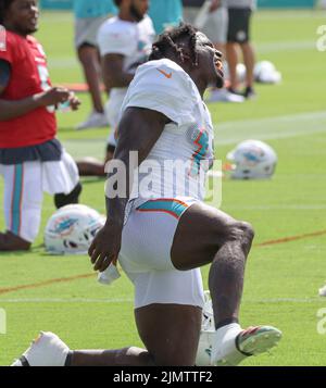 Miami. FL USA;  Wide receiver Tyreek Hill (10) was singing while stretching during Miami Dolphins Training Camp, Saturday, August 6, 2022, at Baptist Stock Photo