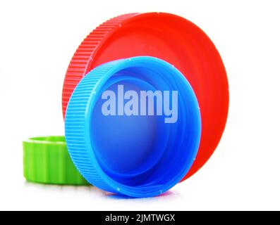 Colorful plastic bottle caps isolated on white. Recycling Stock Photo